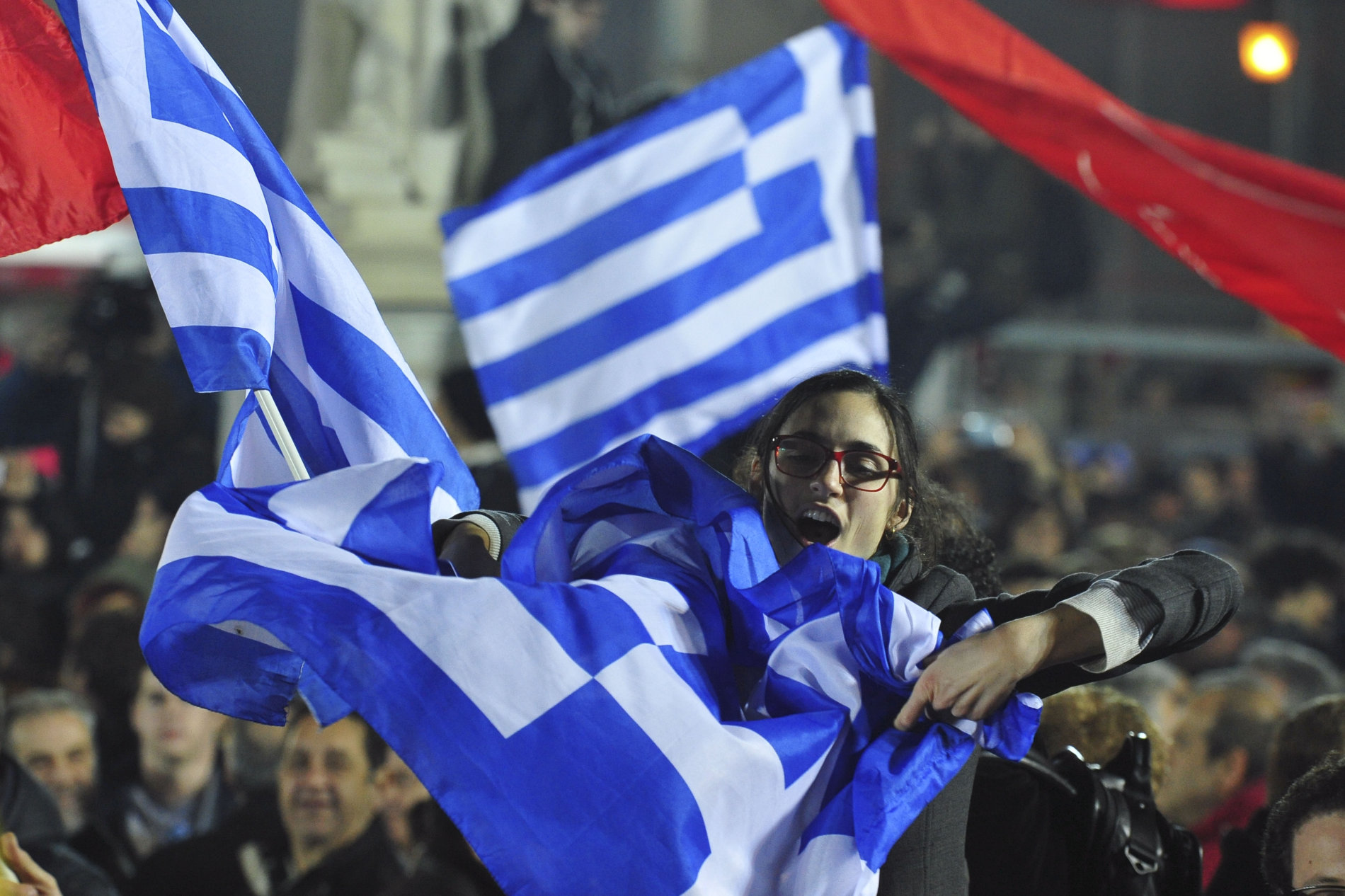 Řekové oslavují vítězství strany Syriza ve volbách.