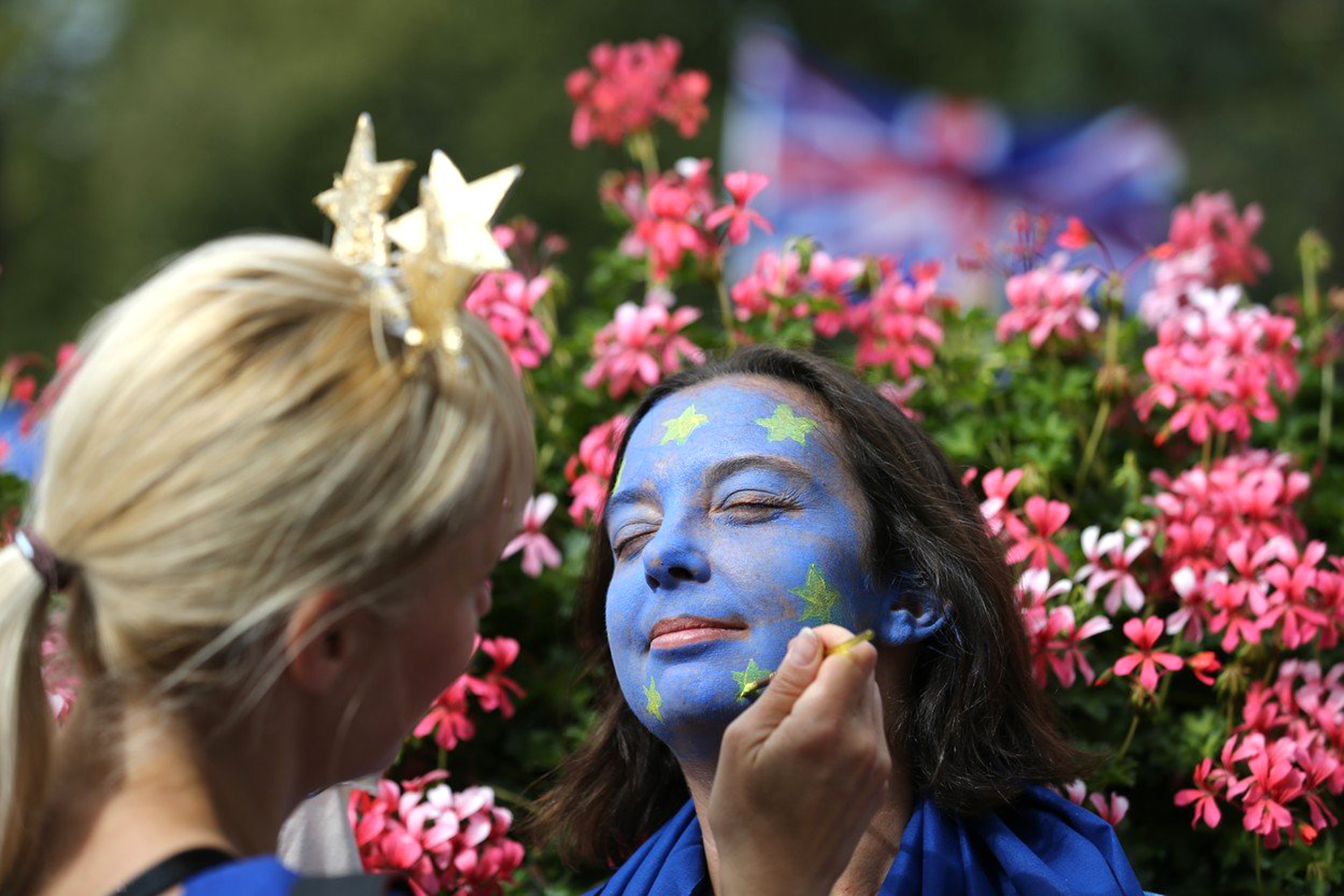 A woman has her face painted like the EU flag ahead of a March for Europe protest against the Brexit vote in London on September 3, 2016. Thousands marched in central London to Parliament Square in a pro-Europe rally against the referendum vote to leave the European Union., Image: 298711299, License: Rights-managed, Restrictions: , Model Release: no, Credit line: Profimedia, AFP