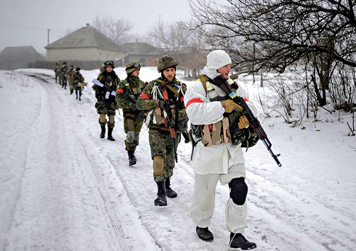 Ukrainian servicemen patrol Orekhovo village in Luhansk region January 28