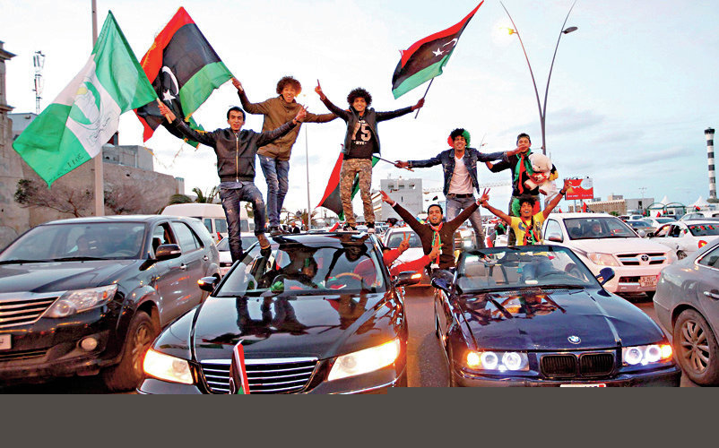 Libyans celebrate the  fourth anniversary of the revolution against Muammar Gaddafi at a street in Tripoli February 17
